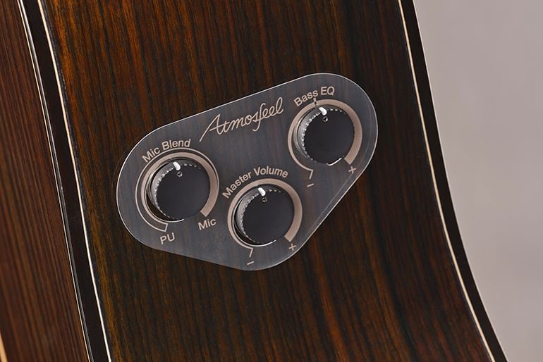 Three control knobs of the FG9 RX Atmosfeel system on the side board are shown. Knobs are for Mic Blend, Master Volume and Bass EQ.