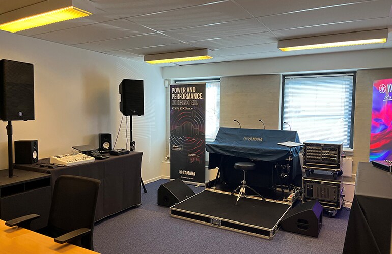 Copenhagen training facility with seating, display screen, and audio demonstration equipment.