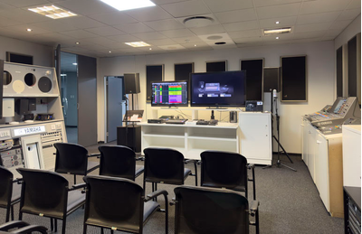 Johannesburg training facility with seating, Yamaha loudspeakers, displays, and audio equipment.
