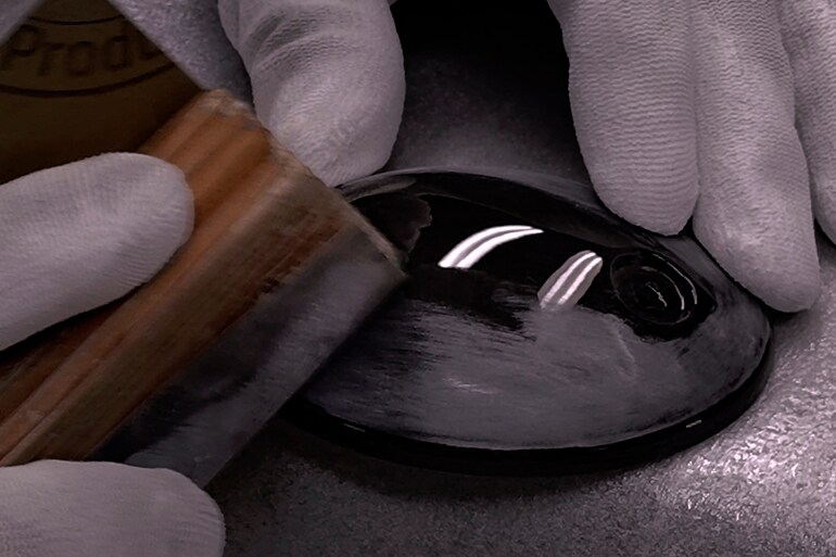 Factory hand crafting scene image of the housing of YHC3000 headphones
