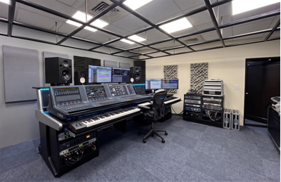 New Taipei City training facility with digital mixing console, loudspeakers, and presentation display.
