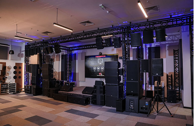 Dubai training facility with professional audio equipment, loudspeakers, and lighting setup.