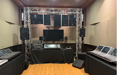 Kuala Lumpur training facility room with stage area, seating, and audio equipment.