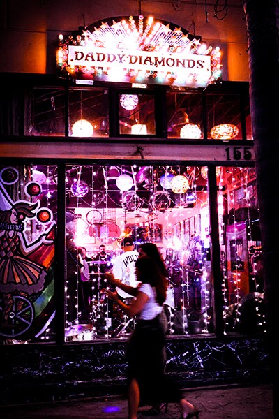 Crowds observe a band from outside of Daddy Diamonds as they line up for next local act on the playbill