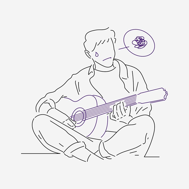 Ein Mann hat Schwierigkeiten beim Üben mit der Gitarre